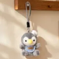 Grauer Plüsch Pinguin Schlüsselanhänger süßer Taschenanhänger Kuscheltier mit Kochmütze Lätzchen - Koch-Pinguin
