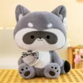 Close up of a cute grey plush raccoon toy holding a love heart pillow with ribbon. - Grey Raccoon / 25 cm (0.22 kg)