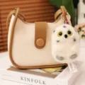 Cute white owl plush pendant hanging on a stylish beige and brown leather handbag charm. - Owl Pendant / 10cm