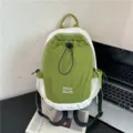 Stylish color-blocked backpack with drawstring and mesh pockets for outdoor travel casual use. - Green