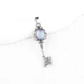Vintage silver-plated ornate key pendant necklace with blue stone inlay for women. - Opal (Antique Silver Color)