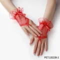 Detailed shot of elegant red lace fingerless gloves with cute bowknot design, delicate bridal accessory. - One Size / Red Lace Gloves