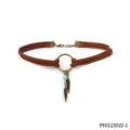 Brown suede choker necklace featuring vintage bronze ring and boho feather turquoise charms. - Brown