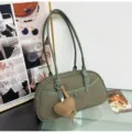 Green canvas shoulder bag for women, stylish underarm baguette bag with knit heart charm. - Green with Pendant