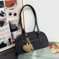 Black nylon shoulder bag for women, stylish baguette handbag with a cute heart charm. - Black With Pendant