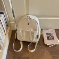 Beige minimalist women's backpack lightweight daily commuter bag stylish casual daypack. - Off White