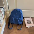 Casual minimalist blue nylon backpack for women, lightweight daily commuter school bookbag. - Dark Blue