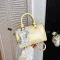 Yellow polka dot boston handbag with lace bow charm, stylish shoulder crossbody bag variant. - Yellow with Pendant