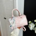 Chic pink polka dot boston bag for women, stylish handbag featuring a cute lace charm design. - Pink With Pendant