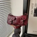 Burgundy patent leather underarm baguette bag, chic motorcycle style shoulder crossbody bag. - Red