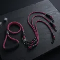 Detailed view of the multi dog leash featuring a braided pink and black rope and durable metal hooks. - Triple 3-Pet / Purple
