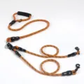 Durable dual dog leash with soft black foam handle and orange geometric woven pattern. - Dual 2-Pet / Orange