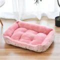 Cozy pink plush pet bed with raised rim, soft cushion for small dogs and cats, warm and comfortable. - Arctic Velvet Pink