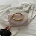 Chic light pink clutch bag with gold sculptural metal handle, stylish evening bag for women. - Pink