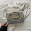Elegant silver evening clutch bag with chic gold irregular ring handle, stylish party purse. - Silver