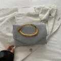 Elegant grey clutch bag with unique gold metal handle, chic french style evening bag for women. - Gray