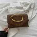 Elegant brown clutch bag with unique gold handle, chic casual evening bag for women. - Brown
