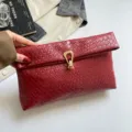 Elegant red woven leather clutch bag for women stylish underarm handbag with gold lock - Red