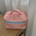 Red grid bow cosmetic bag, quilted makeup storage pouch with handle and blue zipper. - Red Bow