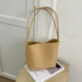 Detail shot of woven leather shoulder bag in beige, elegant minimalist daily fashion tote. - Yellow