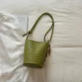 Green woven bucket bag for women, stylish leather shoulder crossbody bag with beaded charm. - With Pendant / Green