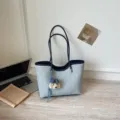 Large capacity denim canvas tote bag for student commuting, stylish shoulder bag with cute puppy charm. - With Charm / Blue