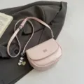 Chic pink saddle shoulder bag for women, stylish crossbody mini bag with metal heart charm. - With Pendant / Pink
