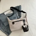 Minimalist messenger bag for women, versatile nylon crossbody bag with small pouch for daily use. - Khaki