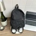 Black mini nylon backpack for daily school and travel, lightweight casual daypack. - Black