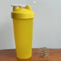 Fitness protein shaker bottle with mixing ball, leak-proof sports water cup for gym training. - 600ml / Yellow