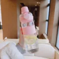 Pink plastic sports water bottle with straw and portable design for daily outdoor use. - Pink