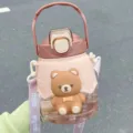 Cute large capacity water bottle with 3d cartoon bear, strap and straw for kids daily use. - Bronze