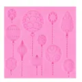 Pink silicone mold featuring various Christmas bauble designs for fondant chocolate decor. - Balloon