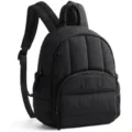 Close-up detail view of the black quilted backpack showing fabric texture and front zipper. - 23.88x11.94x30.99 cm / Black