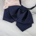 Dark blue JK uniform bow tie closeup, ribbed fabric student neck ribbon accessory detail view - Navy Blue Fine Striped Double Layer Collar Flower