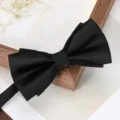 Classic black bow tie for men, elegant satin fabric formal wear accessory for weddings and business. - Black Asymmetric Glossy Bowtie