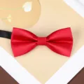 Burgundy bow tie detail showing premium satin texture and neat bow shape for formal suit wear. - F12 Bright Red Glossy Bow Tie