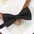 Classic black bow tie detail shot, premium textured fabric for formal wedding business wear. - Black Snowflake Bowtie