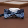 Close-up detail of the elegant blue floral jacquard bow tie, fine fabric and exquisite pattern. - Fantasy Blue Gauze Bow Tie