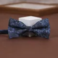 Detailed view of the blue floral jacquard bow tie, elegant men's accessory for formal wear. - Cloud Yarn Dream Gray Blue