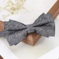 Detailed view of a dark grey textured bow tie, perfect for formal suits, weddings, and business events. - Starry Gray Bowtie