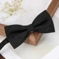 Detail shot of a classic black bow tie for men, stylish accessory for formal events. - Black Stripe Bowtie