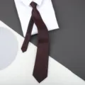Detail shot of a burgundy zipper tie paired with a crisp white shirt collar for formal wear. - 8cm Elegant Burgundy Zipper