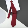 Red striped zipper necktie detail showcasing fabric texture with white shirt on background - 8cm Dark Burgundy Patterned Zipper