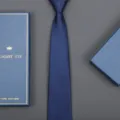 Close-up detail of dark blue textured formal necktie presented with elegant gift box packaging. - Small Grid Zipper Style (Long Gift Box) / 8cm Wide / Navy Blue