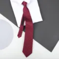 Detailed view of the red polka dot zipper tie showing fabric texture and structure. - 8cm Burgundy Herringbone White Dots Zipper