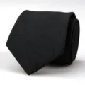 Detailed close-up shot of a stylish black fabric necktie featuring subtle geometric lines. - 8cm Black Snowflake Hand-Tied