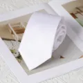 Detail view of a classic solid white men necktie, perfect for formal business and daily work. - 8cm Handmade Style / Rouyunxian White