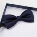 Classic navy blue satin bow tie for men, elegant formal wear accessory in gift box packaging. - New Navy Satin Bowtie
