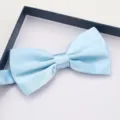 Detail view of a light blue satin bow tie in gift box for wedding and formal suit - Sky Blue Smooth Bow Tie